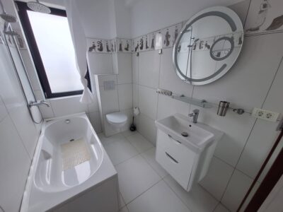 Apartament modern cu terasă generoasă și parcare inclusă