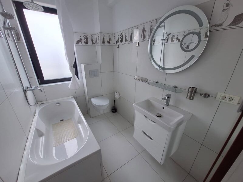Apartament modern cu terasă generoasă și parcare inclusă